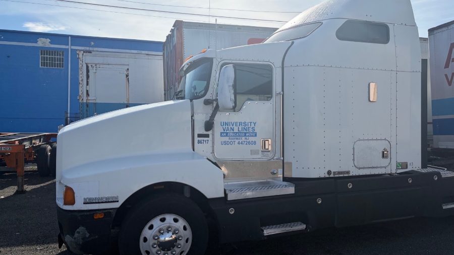 A University Van Lines truck at a residential property
